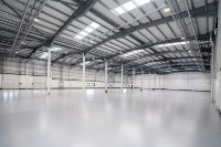 Technology/manufacturing area of c. 2,329 m² (c. 25,069 ft²) with roller shutter doors to yard.